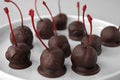 Chocolate dipped cherries on plate Royalty Free Stock Photo