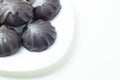 Chocolate dipped marshmallows on white plate. Close up view, white background Royalty Free Stock Photo