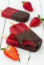 Chocolate dipped strawberry red wine popsicles.