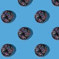 Chocolate donut on a blue background. Seamless background Royalty Free Stock Photo