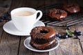 Chocolate donuts with coffee and blueberries Royalty Free Stock Photo