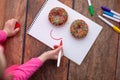 Chocolate donuts in girls hands. Royalty Free Stock Photo