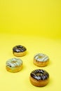 Chocolate donuts on yellow background and space for your advertising. dark retro style background.Collection for celebration Royalty Free Stock Photo