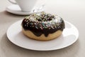 Doughnut on a plate, close-up view with shallow depth of field, 3d render. Photorealistic illustration of a tasty donut