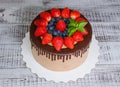 Chocolate drip cake with mint and strawberry