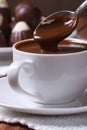 Chocolate dripping from a spoon in a cup closeup Royalty Free Stock Photo