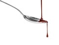 Chocolate dripping from a spoon, isolated on white background Royalty Free Stock Photo