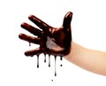 Chocolate drips from a child`s hand on a white background Royalty Free Stock Photo