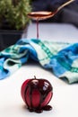 Chocolate drop on red apple fruit Royalty Free Stock Photo