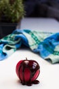 Chocolate drop on red apple fruit Royalty Free Stock Photo