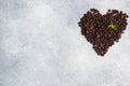 Chocolate drops laid out in the shape of a heart on a gray concrete background. Chocolate pieces for dessert decoration Royalty Free Stock Photo