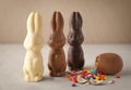 Chocolate Easter Bunnies And Egg On Table