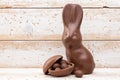 Chocolate Easter bunny, eggs and sweets on rustic background Royalty Free Stock Photo