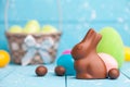 Chocolate Easter bunny, eggs and sweets on rustic background Royalty Free Stock Photo