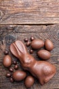 Chocolate Easter bunny and eggs on wooden background Royalty Free Stock Photo