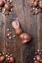 Chocolate Easter bunny and eggs on wooden background Royalty Free Stock Photo