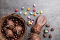 Chocolate Easter bunny and eggs on wooden background Royalty Free Stock Photo