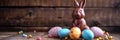 Chocolate Easter bunny and Easter Painted Eggs on wooden background Royalty Free Stock Photo