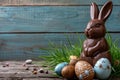 Chocolate Easter bunny and Easter Painted Eggs on wooden background Royalty Free Stock Photo