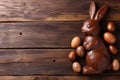 Chocolate Easter bunny and Easter Painted Eggs on wooden background Royalty Free Stock Photo