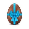 Chocolate Easter egg with blue bow, on a white background, design element for Happy Easter Royalty Free Stock Photo