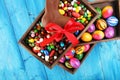 Chocolate Easter eggs and chocolate bunny and colorful sweets. Royalty Free Stock Photo