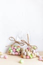 Chocolate Easter eggs, candy in glaze in a transparent bag on a light background Royalty Free Stock Photo