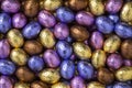 Chocolate easter eggs in colorful tinfoil close up