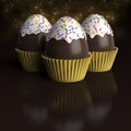 3 Chocolate Easter Eggs inside cupcake cases Royalty Free Stock Photo