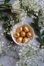 Chocolate Easter Eggs Wrapped in Gold Foil. Easter postcard Royalty Free Stock Photo