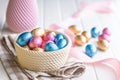 Chocolate easter eggs wrapped in multi colored foil in bowl on white table Royalty Free Stock Photo