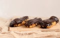 Chocolate eclair on wooden desk food photography. Bekery, cake , choco, pie, confectionary, cream. Three fresh eclairs with chocol