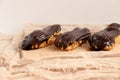 Chocolate eclair on wooden desk food photography. Bekery, cake , choco, pie, confectionary, cream. Three fresh eclairs with chocol