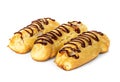 Chocolate eclairs with cream filling on a platter isolated Royalty Free Stock Photo