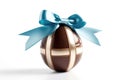 Chocolate Egg With Blue Ribbon Bow On White Background. Generative AI Royalty Free Stock Photo