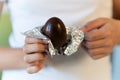 chocolate egg in hands of a teenage girl close-up