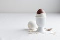 Chocolate egg on white eggstand holder Royalty Free Stock Photo