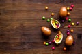 Chocolate eggs - Easter symbol - frame on dark wooden background top-down copy space