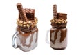 Chocolate extreme milkshake with brownie cake, chocolate paste and sweets. Crazy freakshake food trend. Copy space