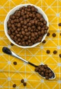 chocolate flake balls, in a deep dish on a yellow bright tablecloth