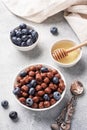 Chocolate flakes made from natural cereals with fresh blueberries, honey and milk. The concept of a healthy wholesome Royalty Free Stock Photo