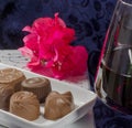 Chocolate flowers red wine glasses
