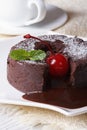 Chocolate fondant with cherries and and coffee. Vertical