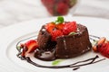 Chocolate fondant (cupcake) with strawberries Royalty Free Stock Photo