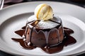 Chocolate fondant with ice cream on a white plate