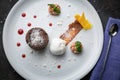 Chocolate fondant with ice cream on a white plate