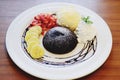 Chocolate fondant lava cake decorated with strawberries and vanilla ice cream Royalty Free Stock Photo