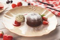 Chocolate fondant with vanilla ice cream and strawberry Royalty Free Stock Photo