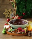 Chocolate fondue with various fruits - delicious dessert Royalty Free Stock Photo