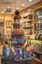 Chocolate fountain in belgium shop Royalty Free Stock Photo